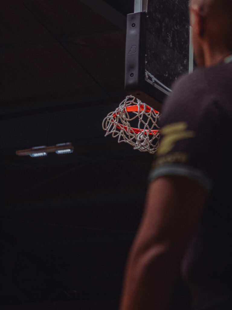 a person holding a basketball hoop