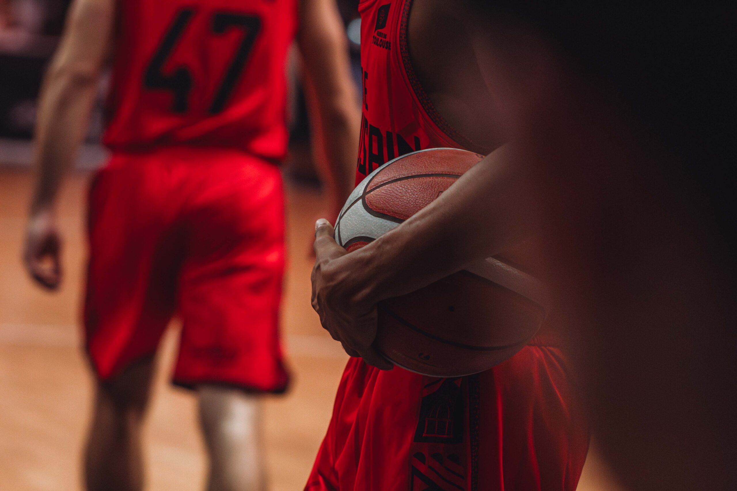 a basketball player holding a ball